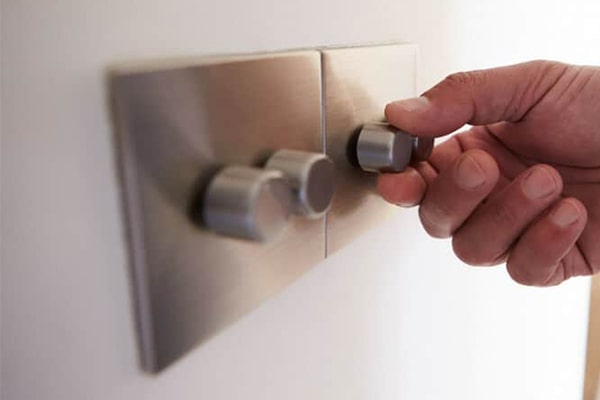 Dimmer Switch for Customised Lighting LED-compatible dimmer switch installed on a white wall